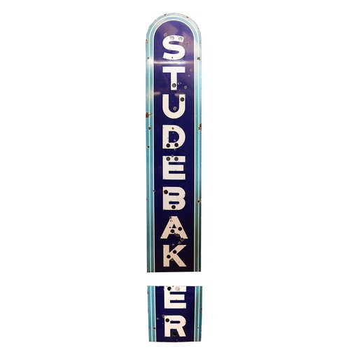 A large Studebaker wall mounted single side vitreous enamel garage display sign, in two parts, lacking the neon, 290 plus 65 x 62cm