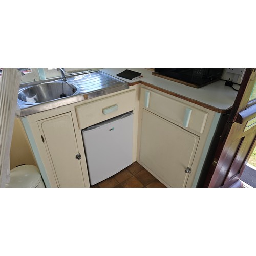 180 - Showman's Caravan, c.1950/60, typical three bay layout with adult bedroom to the front, with bed and... 