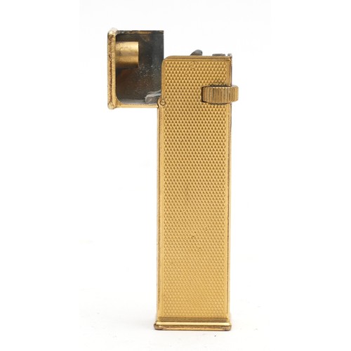 Alfred Dunhill Ltd; A Dunhill tallboy petrol pocket cigarette lighter made under Cartier licence, the gold plated textured body with impressed marks, H6.5cm.