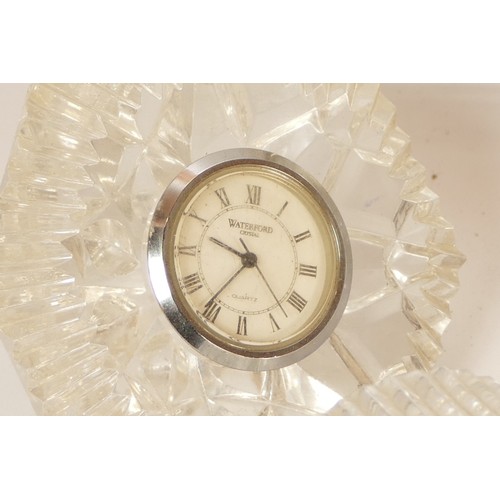 A selection of crystal glass mantel clocks, bedside clocks and ...