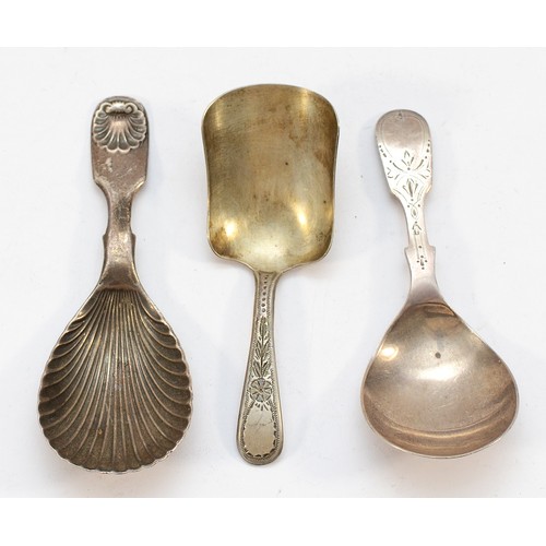 A silver shell shaped caddy spoon, Sheffield 1900, together with two ...
