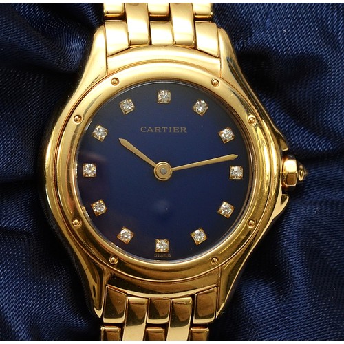 Cartier, an 18ct yellow gold Cougar quartz ladies wristwatch, ref 887906, the blue circular dial set with diamond dot numerals, sapphire cabochon to the crown, the back with Swiss assay marks, 750 and 18k mark, serial no. 004537, with four-row brick link bracelet and clasp, 15.5cm, sold with a Cartier watch/jewellery box, pouch and booklet, approx. 70.4gm.