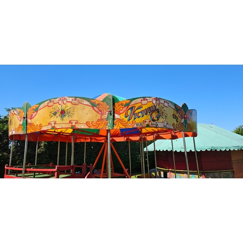 A Coulson's hand turned fairground ride, c.1950's, with cover and rides ...
