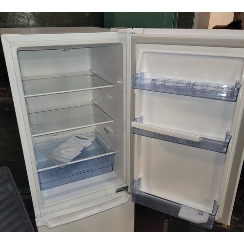 19 - A Fridgemaster tall fridge/freezer, model MC50165, H143, W50, D56cm.