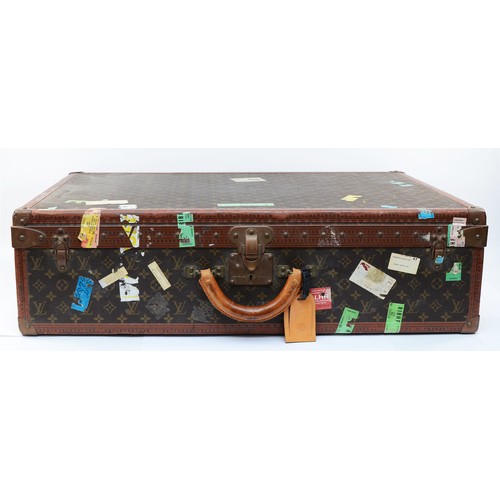 Louis Vuitton monogram suitcase, monogram coated canvas exterior with brown leather edges with LV logos, reinforced with brass rivets, brass corners, three trunk latches with LV logos and a vachetta leather handle. Interior label marked 988132, lock numbered 1016014, two original numbered keys, top trunk box, a vachetta leather ID tag. Multiple travel stickers, 81 x 52 x 22cm.
Condition report, C
By repute bought at the 1988 Christie's Elton John auction.