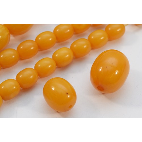 15 - A Bakelite beaded necklace. graduating bead size, largest 25mm, 78cm with two spare beads, 113g