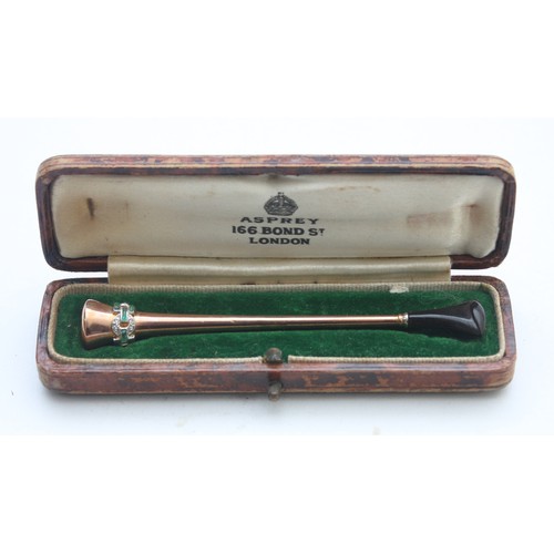 Asprey, an Art Deco, 9ct gold and Platinum, emerald and diamond set cigarette holder, 9ct, 5.2gm, case
