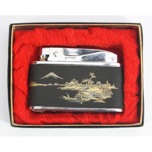 musical cigarette lighter A 1950s 'Prince' Muselite pocket cigarette lighter, petrol operated, having  manual wind-up musical m