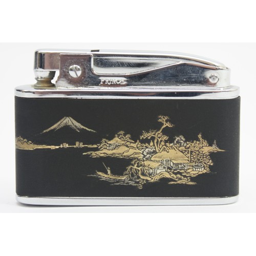 A 1950s 'Prince' Muselite pocket cigarette lighter, petrol operated, having  manual wind-up musical m