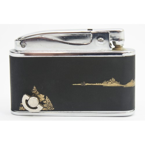 A 1950s 'Prince' Muselite pocket cigarette lighter, petrol operated, having  manual wind-up musical m