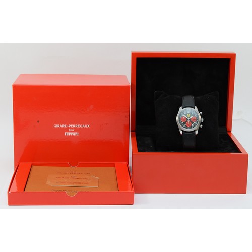 Girard-Perregaux Ferrari F1-052 Chronograph titanium automatic limited edition wristwatch, c.2004, 75/200,  black carbon dial with three subsidiary red dials, outer tachymeter scale, date aperture at 4.30, exhibition case, 26 jewel cal GP4000 movement, rubber strap, 40mm.
Original guarantee card dated 2005, booklets, box and outer case.
Not working when catalogued, rotor spins, balance spins, original strap, would benefit from a clean.