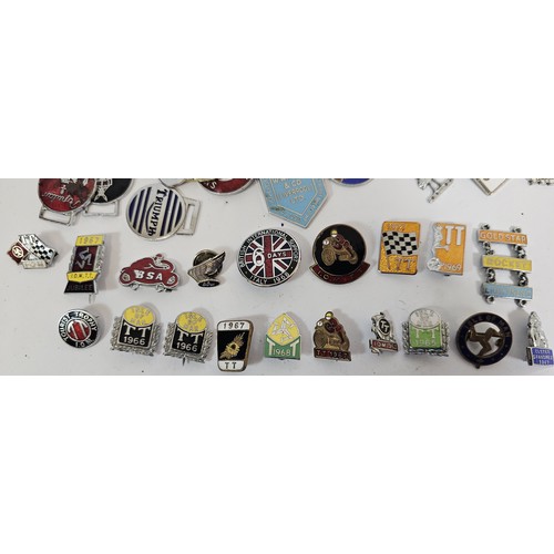 60 - A collection of vintage car/motorcycle lapel and key ring badges, including the TT, together with a ... 