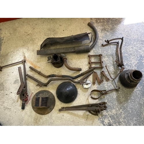 164 - An autojumblers lot, to include Triumph Model H parts, Lucas head lamp shell and fork links.