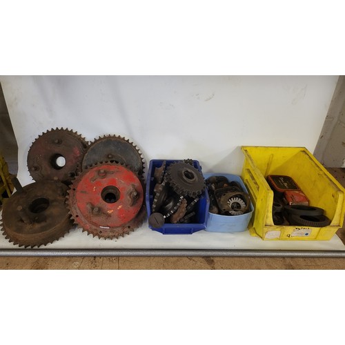 175 - A box of Norton spares to include front and rear sprockets, and smaller items including electrical p... 