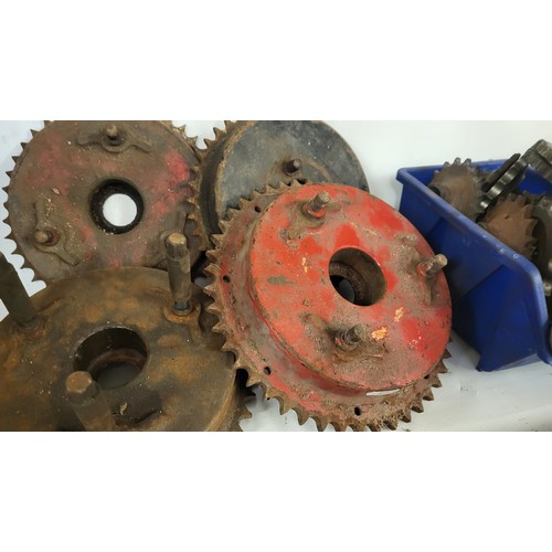 175 - A box of Norton spares to include front and rear sprockets, and smaller items including electrical p... 