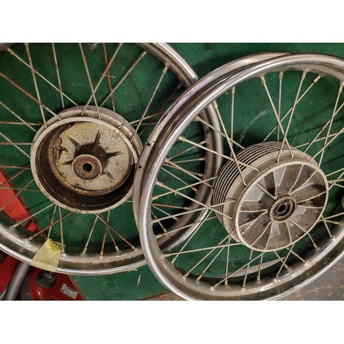 180 - A pair of motorcycle wheels, possibly NSU, together with another pair (4)