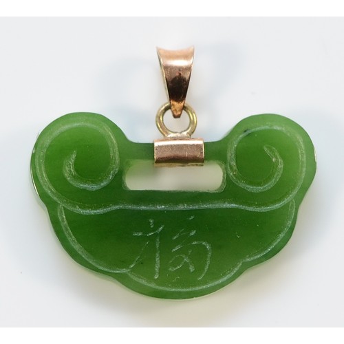 2 - A 9ct gold carved jade pendant, 25mm, 3.2g