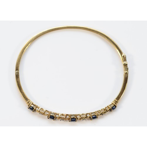 12 - A 9ct gold sapphire and diamond hinged bangle, 60mm, 7.8g