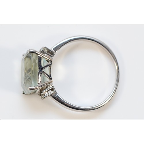 30 - A 9ct white gold prasiolite solitaire ring with diamond set shoulders, 11mm x 9mm prasiolite, N, 3.3... 