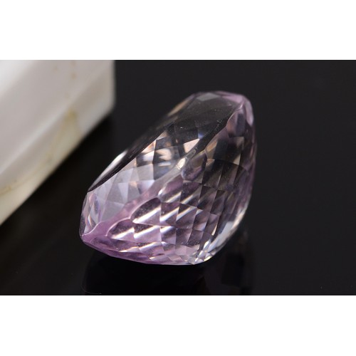 36 - An oval cut blue gemstone, probably blue topaz, measures 48.87ct on the Gemscale 125 Dendritics, 25m... 