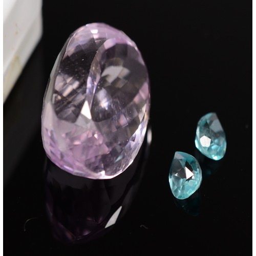 36 - An oval cut blue gemstone, probably blue topaz, measures 48.87ct on the Gemscale 125 Dendritics, 25m... 