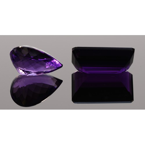 37 - An emerald cut amethyst, measures 33.57ct on the Gemscale 125 Dendritics, 25mm x 15mm x 10mm, with a... 