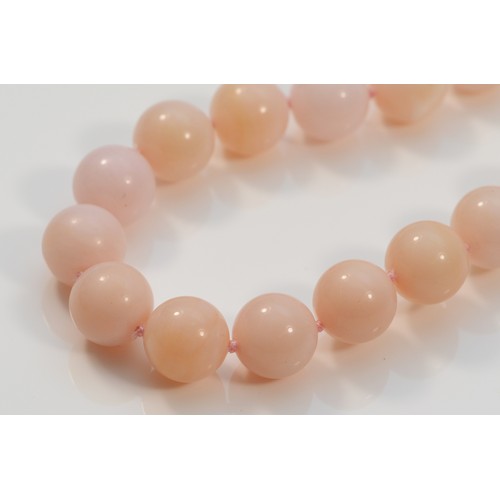 44 - A 9ct gold clasped pink beaded necklace, 13mm beads, 44cm, 68g