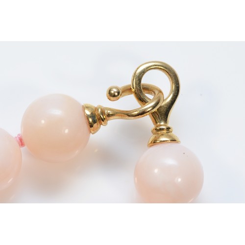 44 - A 9ct gold clasped pink beaded necklace, 13mm beads, 44cm, 68g