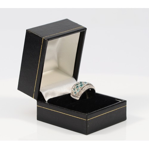 49 - A 14K white gold diamond and blue gemstone dress ring, possibly blue zircon, J 1/2, 7.2g
