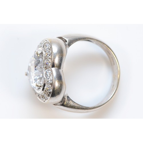 50 - An 18ct white gold and white gemstone ring, central stone is heart shaped, 10mm, O, 11g