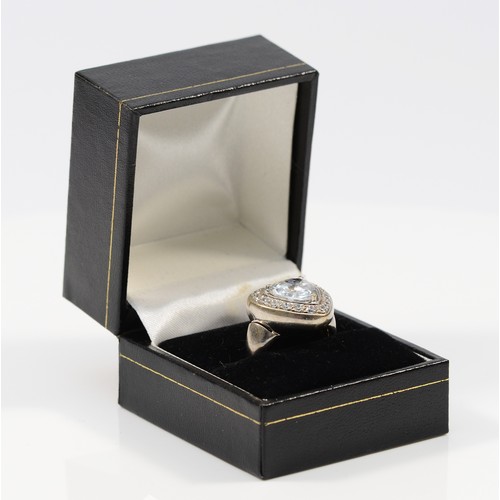 50 - An 18ct white gold and white gemstone ring, central stone is heart shaped, 10mm, O, 11g