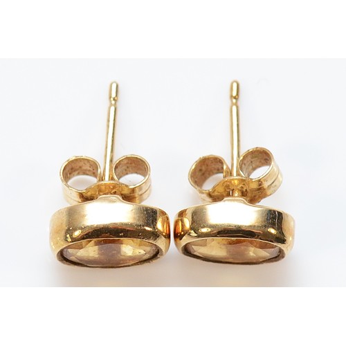 52 - A pair of 9ct gold citrine earrings with scroll backs, 1.8g