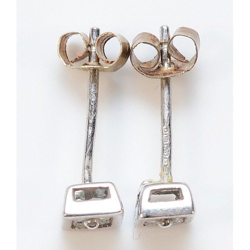 53 - A pair of 9ct white gold diamond earrings with scroll backs, 0.7g