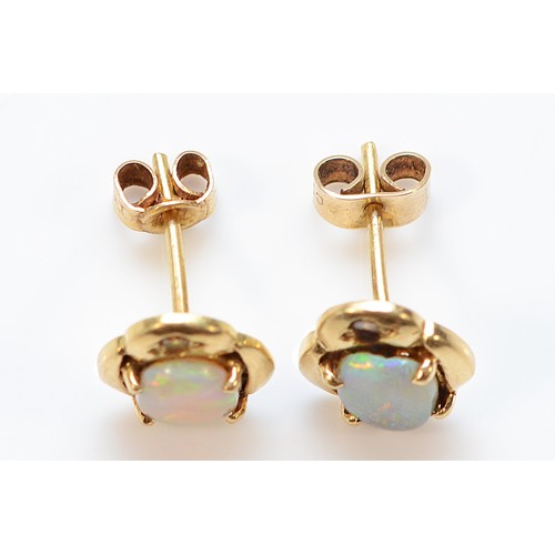 58 - A pair of 9ct gold opal diamond earrings with scroll backs, 2.3g