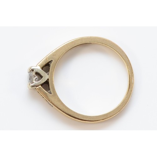 59 - A 9ct gold brilliant cut diamond solitaire ring with diamond set shoulders, J, 2.6g