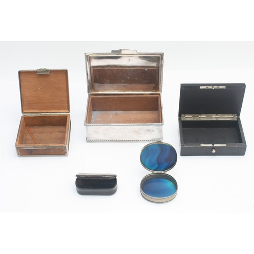 26 - Three early 20th century cigarette boxes, including silver plated, ebonised and boxwood examples, to... 