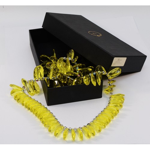 Mawi, a yellow acrylic and glass bead necklace, with pouch and box