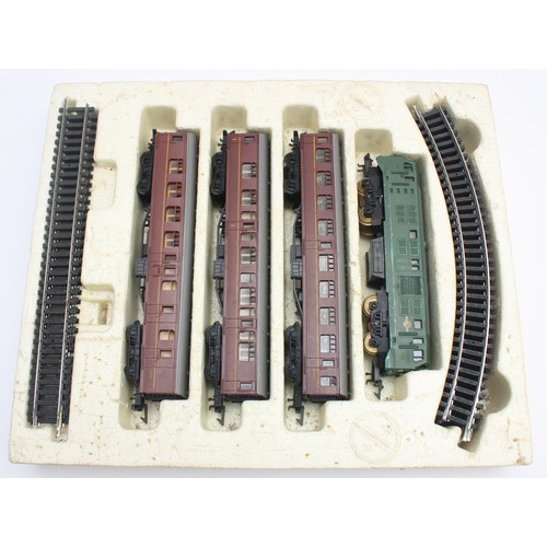 13 - Three boxed train sets to include, Playcraft OO/HO gauge railway layout, Tri-ang OO/HO gauge electri... 