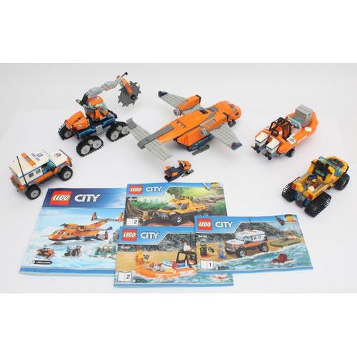 43 - Lego; A group of five ready built Lego models, including Lego City Coast Guard models, four with ins... 