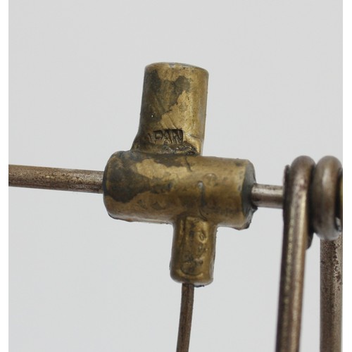 57 - Jinsey Shinan (Japan) clockwork toy model of a painted celluloid doll on a wind-up acrobatic swing m... 