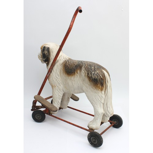 58 - A 1950s Triang push and ride along toy, modelled after a Saint Bernard dog.