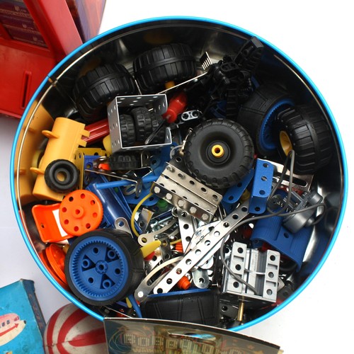 59 - A collection of vintage toys to include a boxed tinplate 'Toy-Town' telephone exchange, a Peter Pan ... 