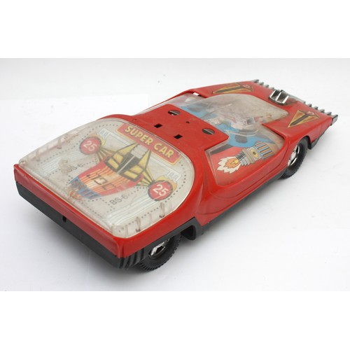 59 - A collection of vintage toys to include a boxed tinplate 'Toy-Town' telephone exchange, a Peter Pan ... 