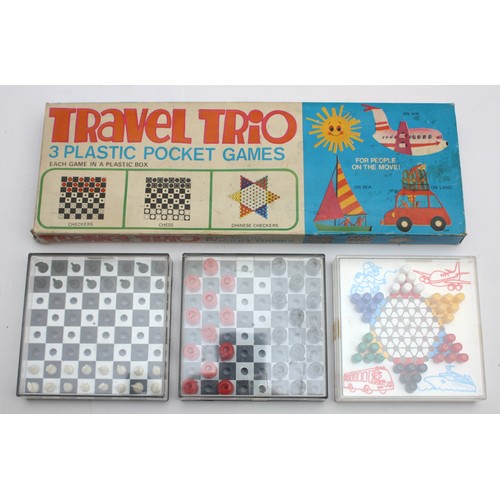 59 - A collection of vintage toys to include a boxed tinplate 'Toy-Town' telephone exchange, a Peter Pan ... 