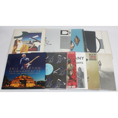 138 - A Large collection of Vinyl singles along with some Bad Company LP's to include artists, The Rolling... 
