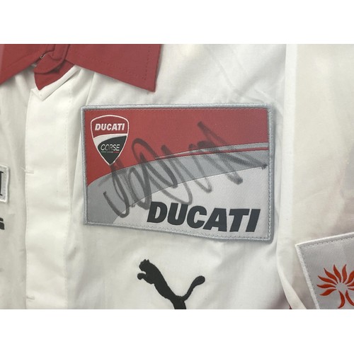 168 - A framed Ducati racing jacket bearing two signatures, possibly Valentino Rossi, 87cm x 67.