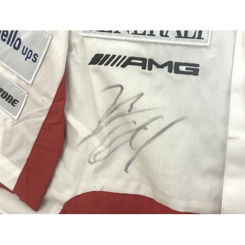 168 - A framed Ducati racing jacket bearing two signatures, possibly Valentino Rossi, 87cm x 67.