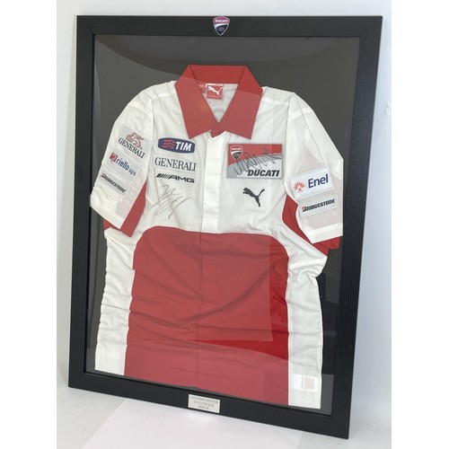 168 - A framed Ducati racing jacket bearing two signatures, possibly Valentino Rossi, 87cm x 67.