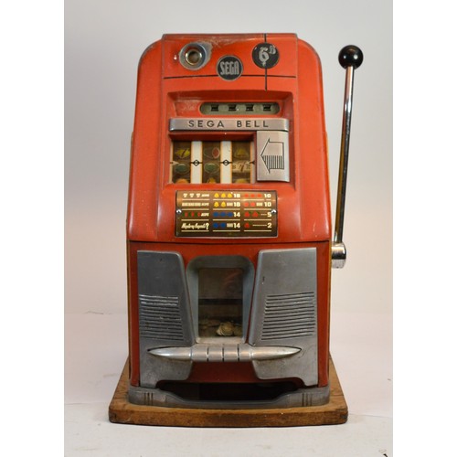 A 1960s Sega Bell slot machine/fruit machine 'One Arm Bandit' mechanical coin operated 6d accepting sixpence coins, with key, fully working when catalogued, H66, W40, D39cm.