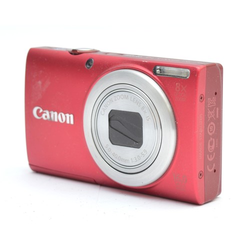 A Canon Powershot A4000 IS digital camera, in red, boxed.